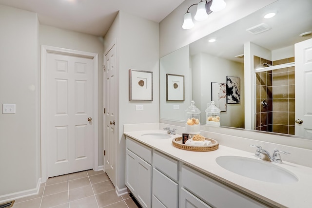 458 Bower Ln, Oswego, IL 60543 - bathroom featuring double vanity, tile patterned floors, tiled shower, and recessed lighting