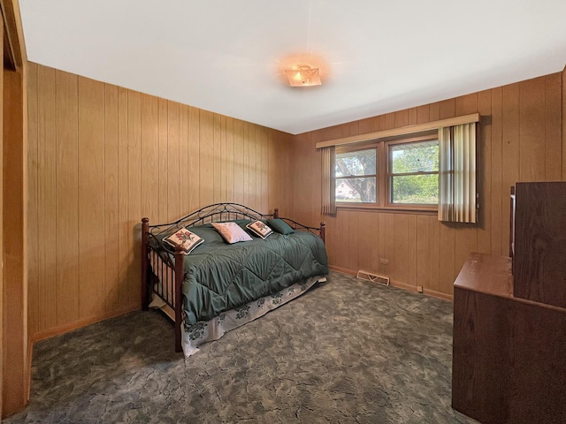 17225 Laflin Ave, East Hazel Crest, IL 60429 - bedroom featuring wooden walls and dark carpet