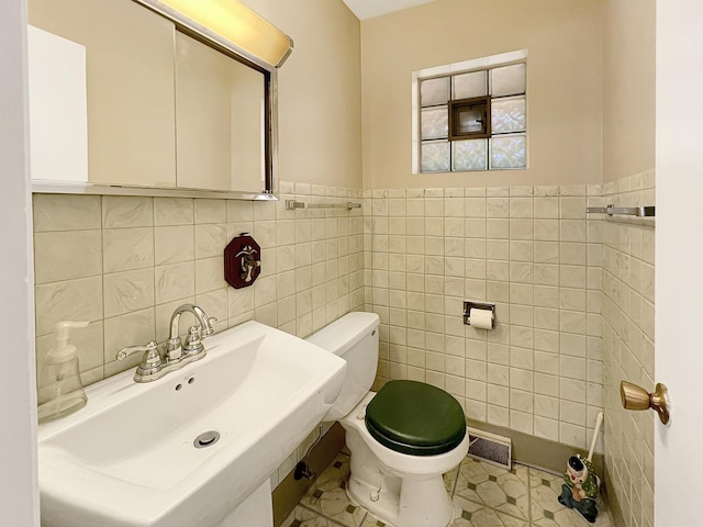 17225 Laflin Ave, East Hazel Crest, IL 60429 - half bathroom featuring tile walls and a wainscoted wall