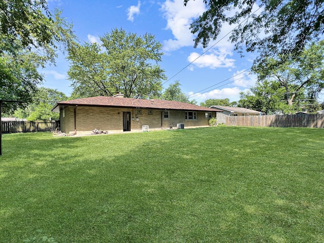 17225 Laflin Ave, East Hazel Crest, IL 60429 - rear view of property featuring a fenced backyard and a chimney