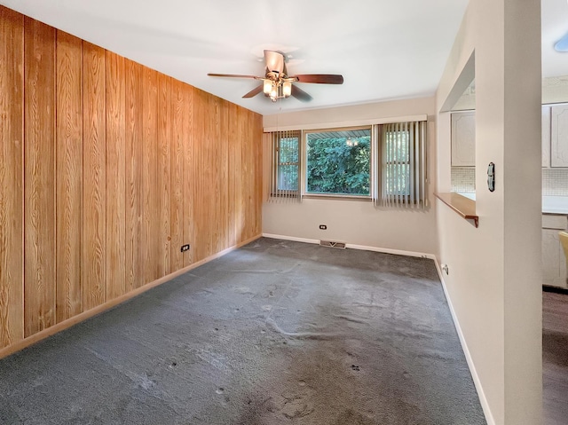 17225 Laflin Ave, East Hazel Crest, IL 60429 - empty room featuring ceiling fan, carpet floors, and wood walls