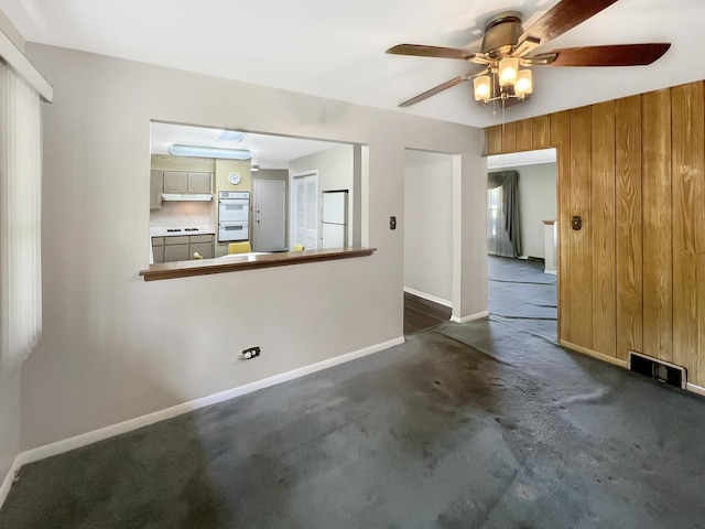 17225 Laflin Ave, East Hazel Crest, IL 60429 - unfurnished living room with ceiling fan, dark colored carpet, and wood walls