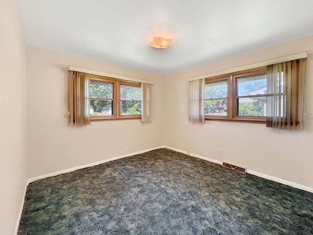 17225 Laflin Ave, East Hazel Crest, IL 60429 - empty room with plenty of natural light and dark colored carpet