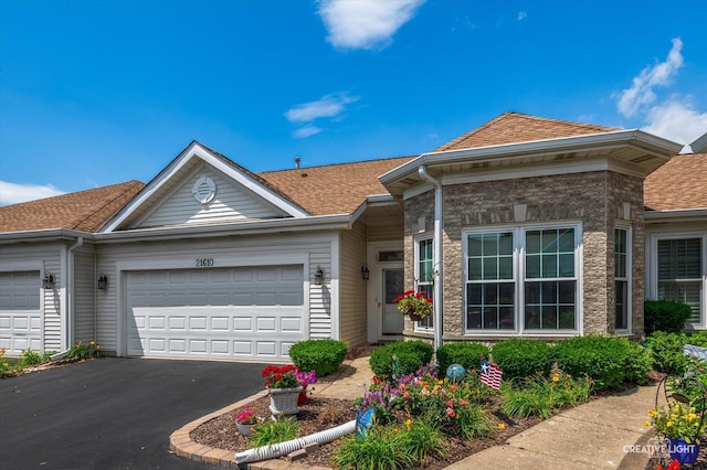 21610 W Empress Ln, Plainfield, IL 60544 - view of front of house with a garage, asphalt driveway, and a shingled roof