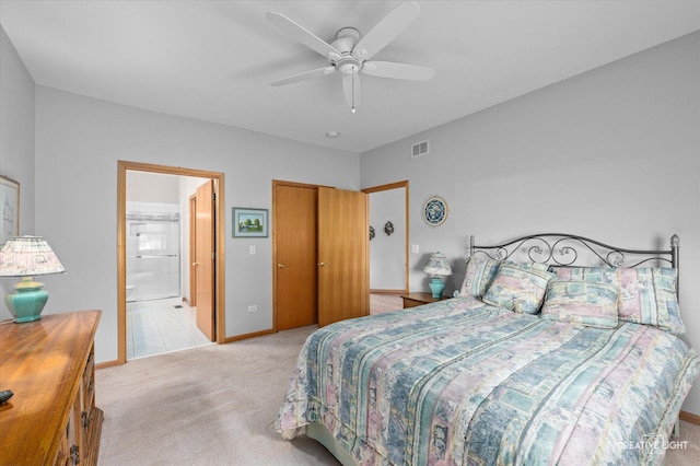 21610 W Empress Ln, Plainfield, IL 60544 - bedroom with light colored carpet, connected bathroom, ceiling fan, and a closet