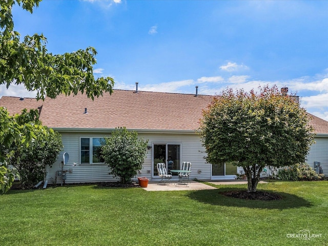 21610 W Empress Ln, Plainfield, IL 60544 - back of property with a lawn, a patio area, and a shingled roof
