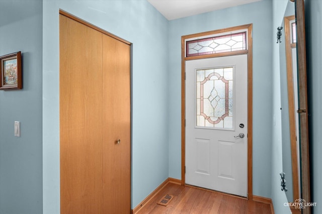 21610 W Empress Ln, Plainfield, IL 60544 - foyer with light wood-style flooring and baseboards