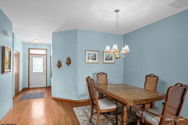 21610 W Empress Ln, Plainfield, IL 60544 - dining space with a chandelier and light wood-style flooring