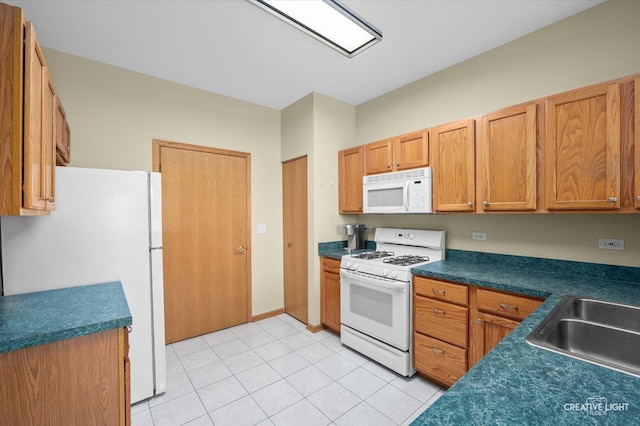 21610 W Empress Ln, Plainfield, IL 60544 - kitchen with white appliances, dark countertops, light tile patterned floors, and brown cabinetry