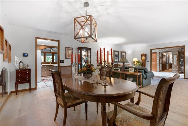 25316 E 1100 N Rd, Downs, IL 61736 - dining space featuring light wood finished floors and a chandelier