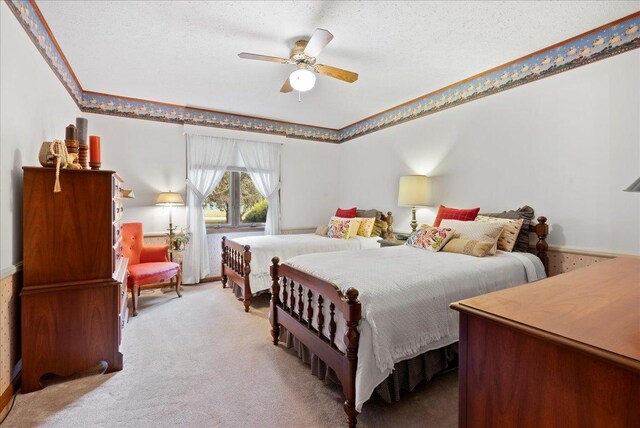 25316 E 1100 N Rd, Downs, IL 61736 - bedroom with carpet, a ceiling fan, and a textured ceiling