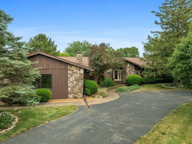 25316 E 1100 N Rd, Downs, IL 61736 - view of front of house featuring stone siding and a chimney