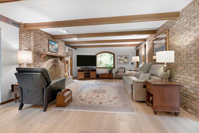 25316 E 1100 N Rd, Downs, IL 61736 - living room featuring light wood-style floors, a brick fireplace, beam ceiling, and brick wall