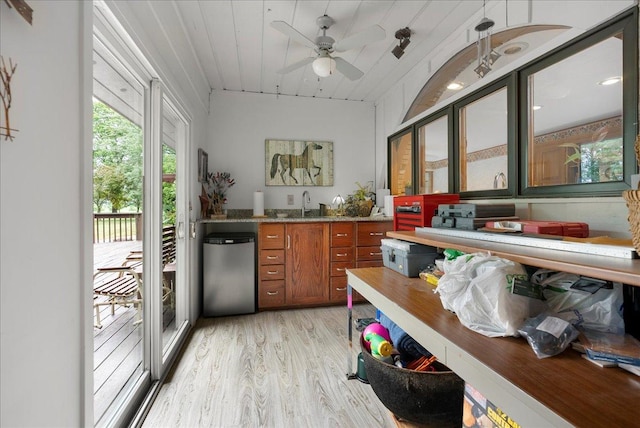 25316 E 1100 N Rd, Downs, IL 61736 - kitchen featuring stainless steel dishwasher, light wood finished floors, brown cabinets, and ceiling fan