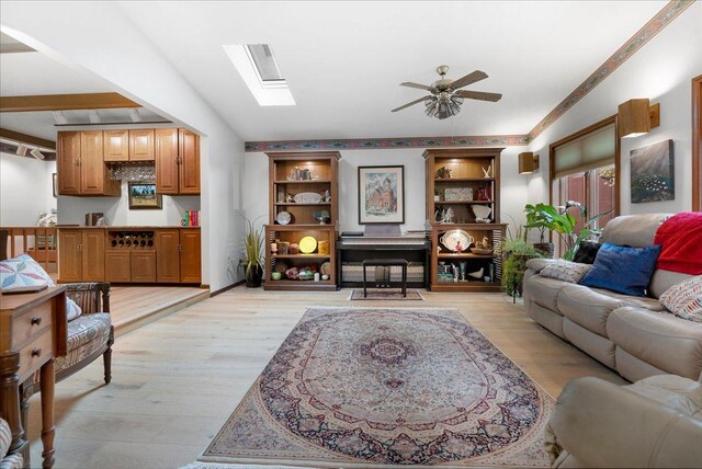 25316 E 1100 N Rd, Downs, IL 61736 - living room featuring ceiling fan, light wood-style floors, and a skylight