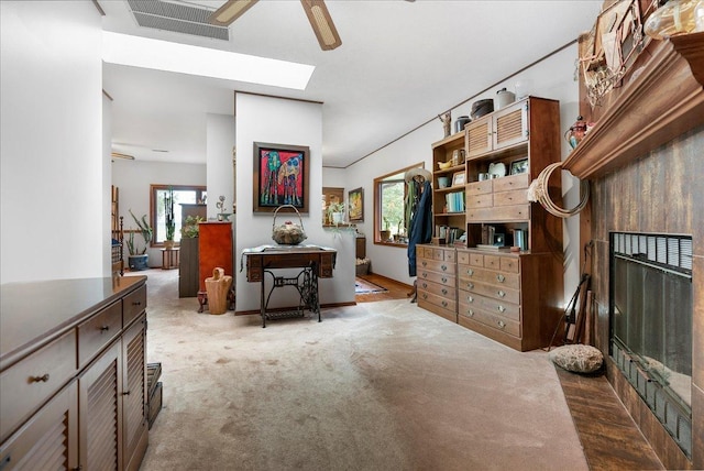 25316 E 1100 N Rd, Downs, IL 61736 - interior space featuring carpet flooring, a ceiling fan, and a skylight