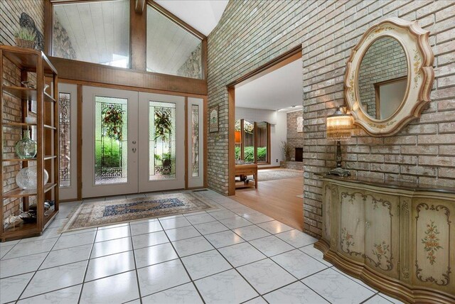 25316 E 1100 N Rd, Downs, IL 61736 - entrance foyer with french doors, high vaulted ceiling, and brick wall