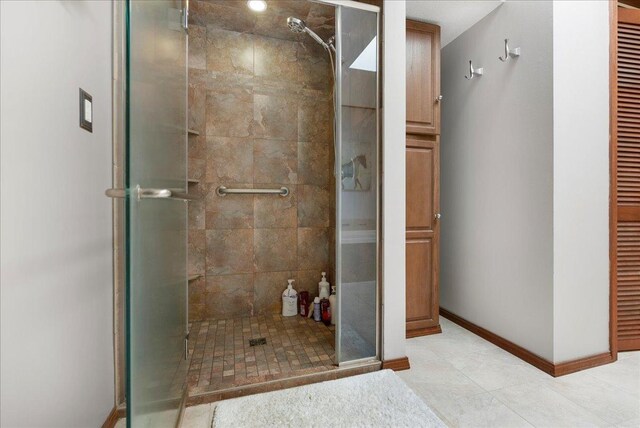 25316 E 1100 N Rd, Downs, IL 61736 - full bath with a stall shower, a closet, and tile patterned floors