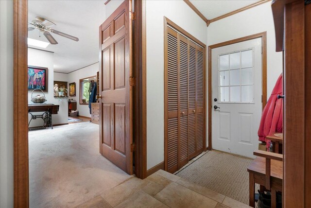 25316 E 1100 N Rd, Downs, IL 61736 - foyer with ceiling fan, light colored carpet, and ornamental molding