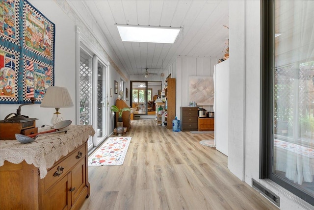 25316 E 1100 N Rd, Downs, IL 61736 - hallway with a skylight and light wood-type flooring
