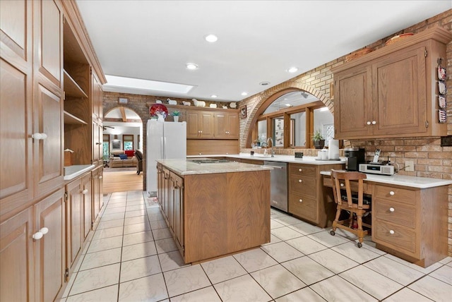 25316 E 1100 N Rd, Downs, IL 61736 - kitchen featuring stainless steel appliances, a center island, a skylight, recessed lighting, and light tile patterned flooring