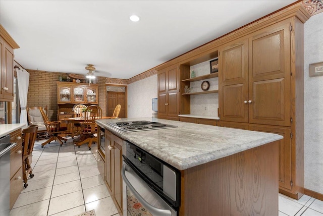 25316 E 1100 N Rd, Downs, IL 61736 - kitchen featuring stainless steel appliances, a kitchen island, open shelves, ceiling fan, and light tile patterned floors