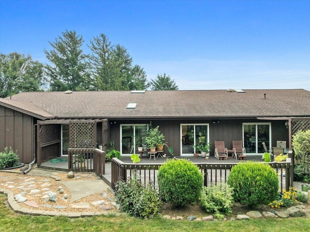 25316 E 1100 N Rd, Downs, IL 61736 - back of house featuring a wooden deck, a shingled roof, and board and batten siding
