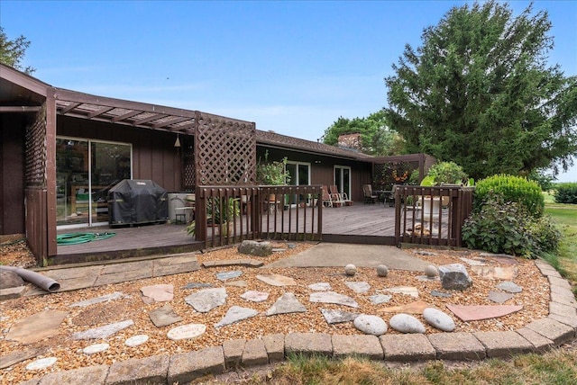 25316 E 1100 N Rd, Downs, IL 61736 - back of property with a wooden deck and a chimney