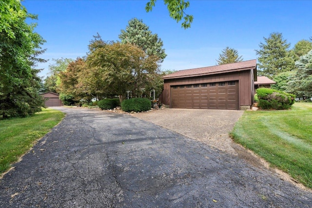 25316 E 1100 N Rd, Downs, IL 61736 - view of front of home featuring a detached garage and a front yard