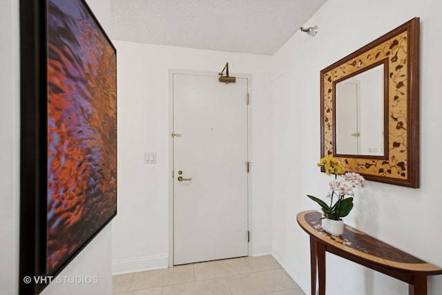 1250 N Dearborn St Unit 11C, Chicago, IL 60610 - entrance foyer with light tile patterned flooring and baseboards