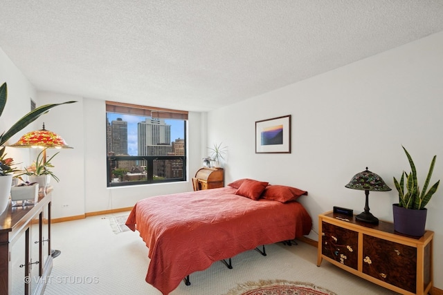 1250 N Dearborn St Unit 11C, Chicago, IL 60610 - bedroom featuring carpet, a textured ceiling, and a view of city