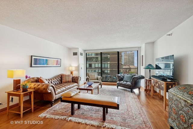 1250 N Dearborn St Unit 11C, Chicago, IL 60610 - living room with wood finished floors and a textured ceiling