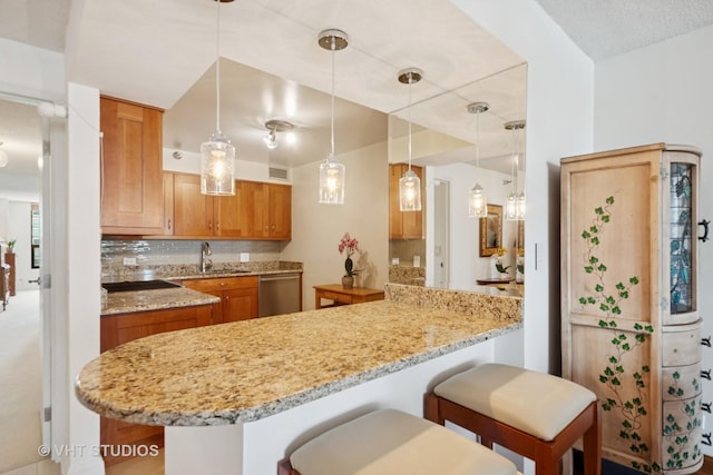 1250 N Dearborn St Unit 11C, Chicago, IL 60610 - kitchen with stainless steel dishwasher, backsplash, brown cabinetry, and a peninsula