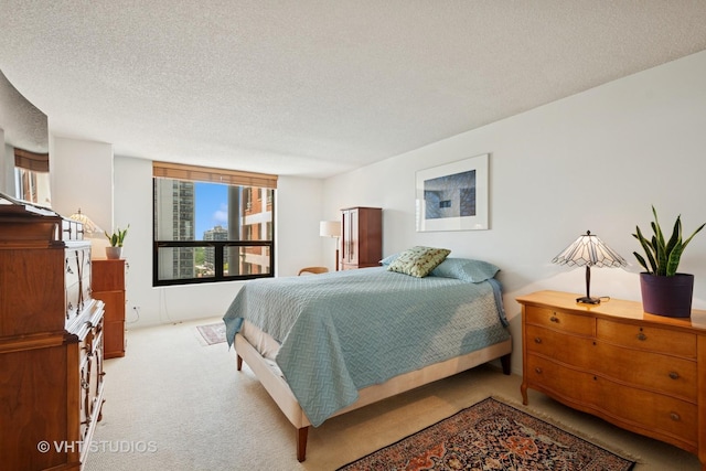 1250 N Dearborn St Unit 11C, Chicago, IL 60610 - bedroom featuring carpet floors and a textured ceiling
