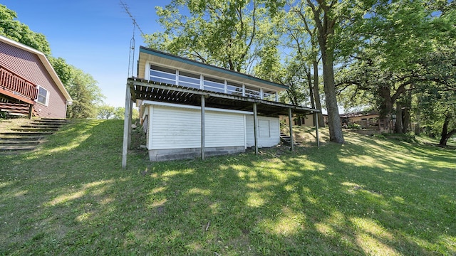 7198 S Rock Nation Rd, Dixon, IL 61021 - back of house with a deck and a yard