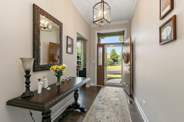 4100 Coyote Lakes Cir, Lake In The Hills, IL 60156 - foyer featuring a chandelier, crown molding, and dark wood-type flooring