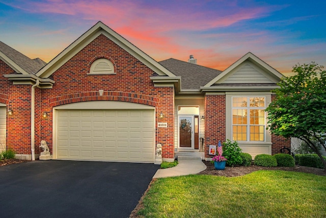 4100 Coyote Lakes Cir, Lake In The Hills, IL 60156 - traditional-style home featuring brick siding, asphalt driveway, a shingled roof, a yard, and a chimney