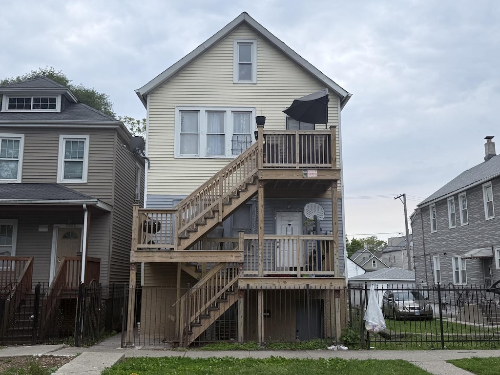 8822 S Exchange Ave, Chicago, IL 60617 - rear view of house featuring stairway and a deck
