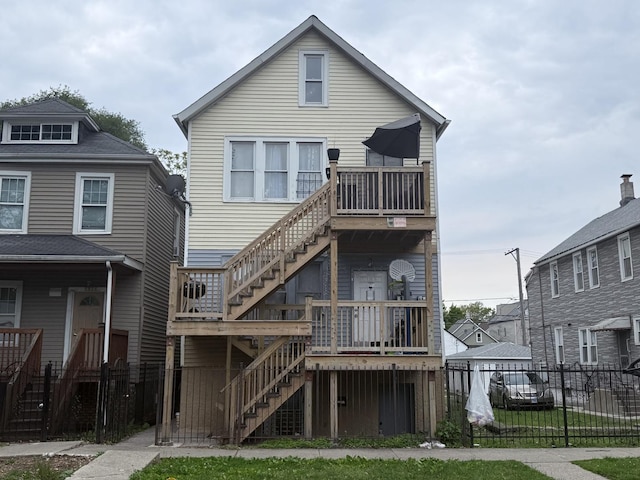 8822 S Exchange Ave, Chicago, IL 60617 - rear view of house featuring stairway and a deck