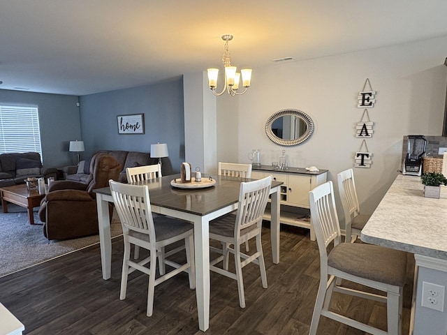 582 Spring Leaf Dr, Joliet, IL 60431 - dining area featuring dark wood-type flooring and a chandelier