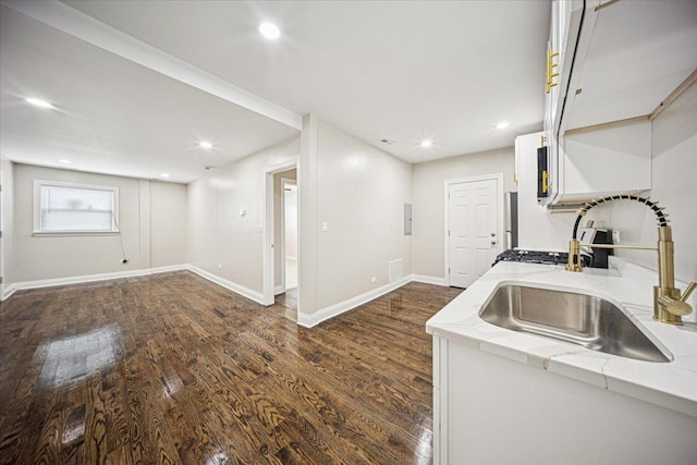 10188 S Winston Ave, Chicago, IL 60643 - kitchen featuring dark wood-style floors, recessed lighting, light stone countertops, white cabinetry, and electric panel