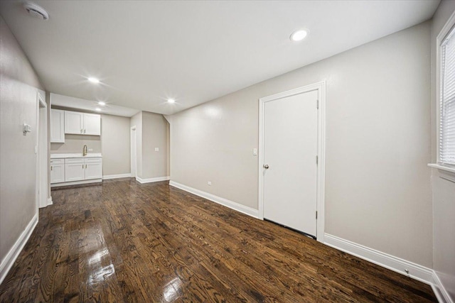 10188 S Winston Ave, Chicago, IL 60643 - unfurnished living room featuring dark wood-style floors and recessed lighting
