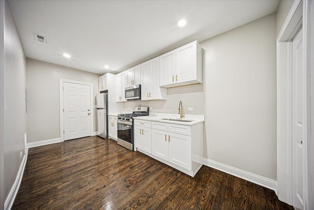 10188 S Winston Ave, Chicago, IL 60643 - kitchen with stainless steel appliances, white cabinets, dark wood-type flooring, light countertops, and recessed lighting