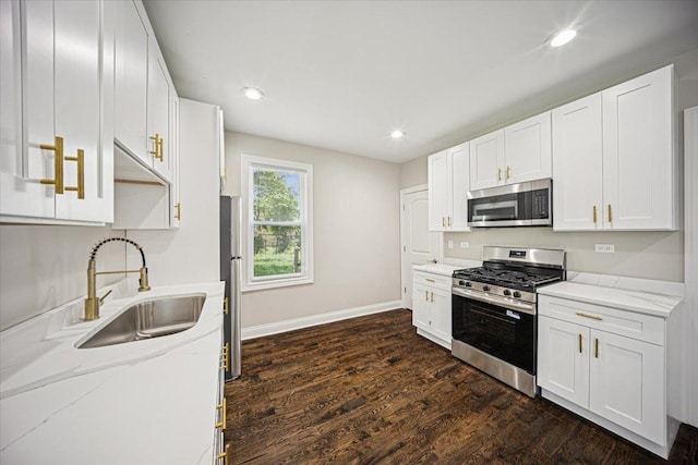 10188 S Winston Ave, Chicago, IL 60643 - kitchen with appliances with stainless steel finishes, white cabinets, dark wood-style flooring, light stone countertops, and recessed lighting