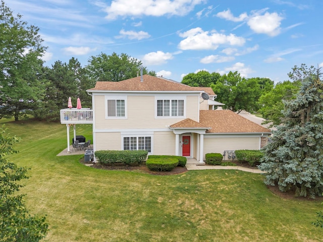 931 Mesa Dr, Elgin, IL 60123 - traditional-style house with a front lawn, a patio area, and a shingled roof