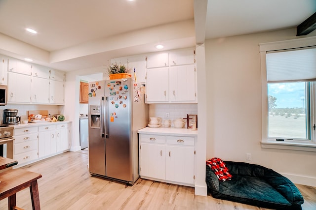 1533 E 1400 N Rd, Crescent City, IL 60928 - kitchen featuring stainless steel fridge with ice dispenser, light wood-style flooring, light countertops, backsplash, and white cabinets