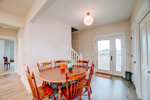1533 E 1400 N Rd, Crescent City, IL 60928 - dining space with light wood-style flooring and stairway
