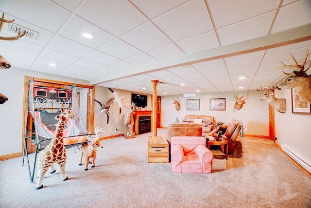 1533 E 1400 N Rd, Crescent City, IL 60928 - living room featuring carpet flooring, a drop ceiling, recessed lighting, a baseboard heating unit, and a fireplace