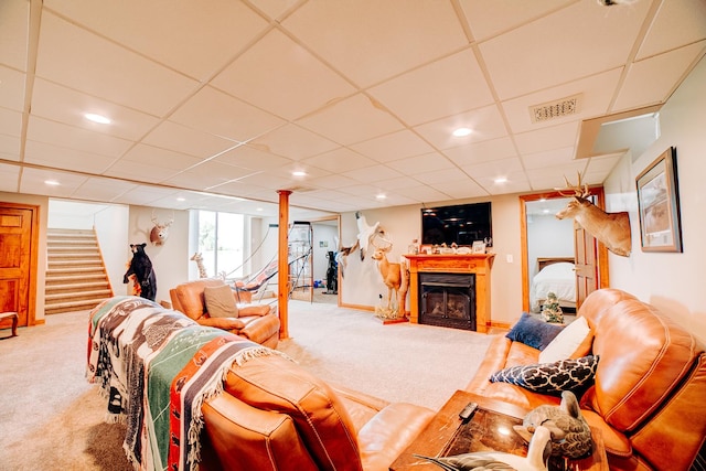 1533 E 1400 N Rd, Crescent City, IL 60928 - living area with carpet floors, stairs, a drop ceiling, a fireplace, and recessed lighting