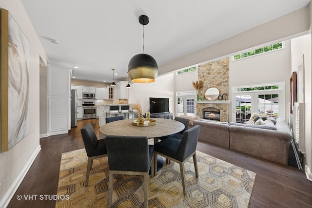 128 W Windsor Ave, Lombard, IL 60148 - dining room featuring dark wood-style floors, a stone fireplace, and recessed lighting